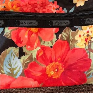 LeSportsac Black and Red Crossbody Bag with Floral Design